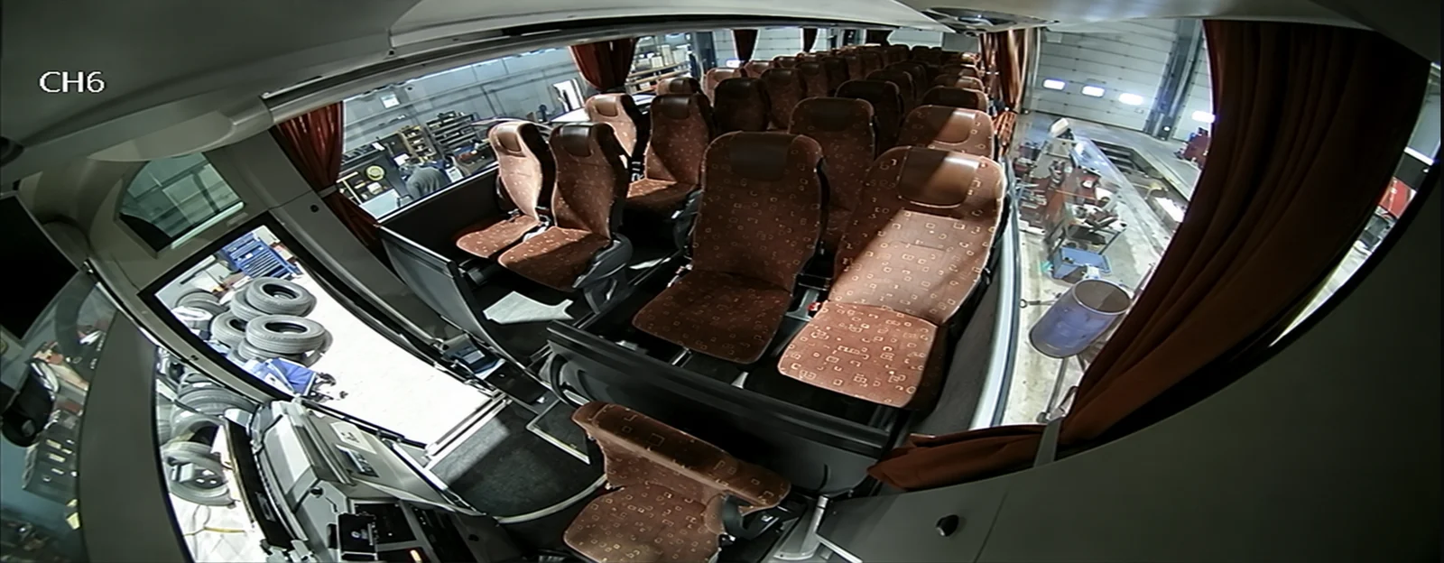Privacy-edited empty coach interior camera example