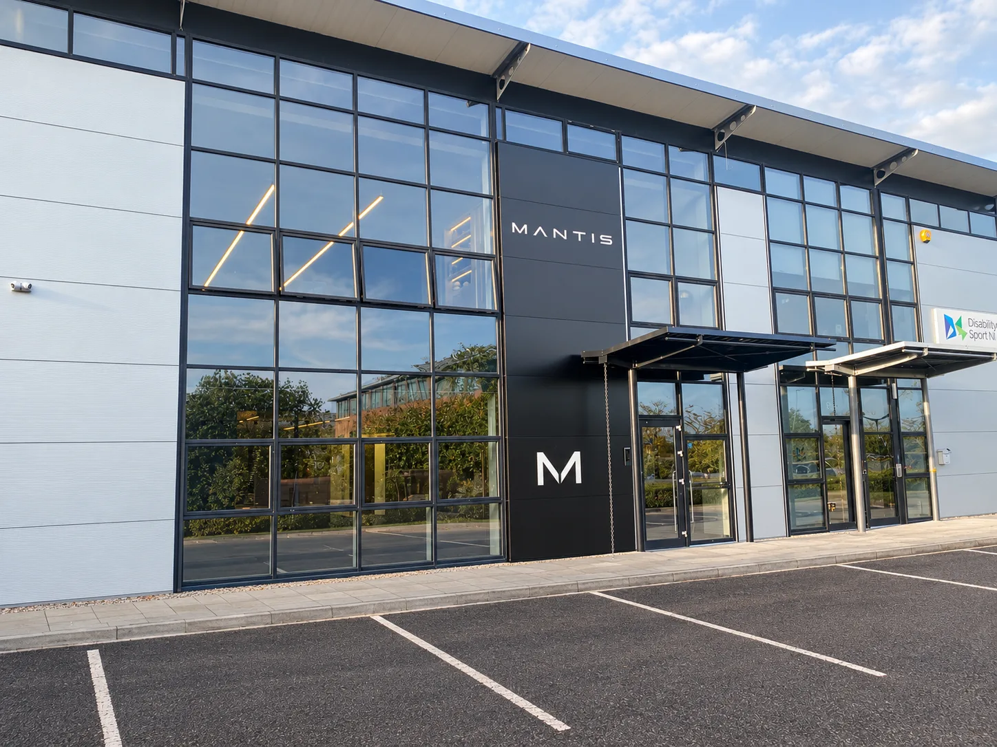 The new MANTIS headquarters at Portside Business Park, Belfast, with MANTIS signage beside the entrance