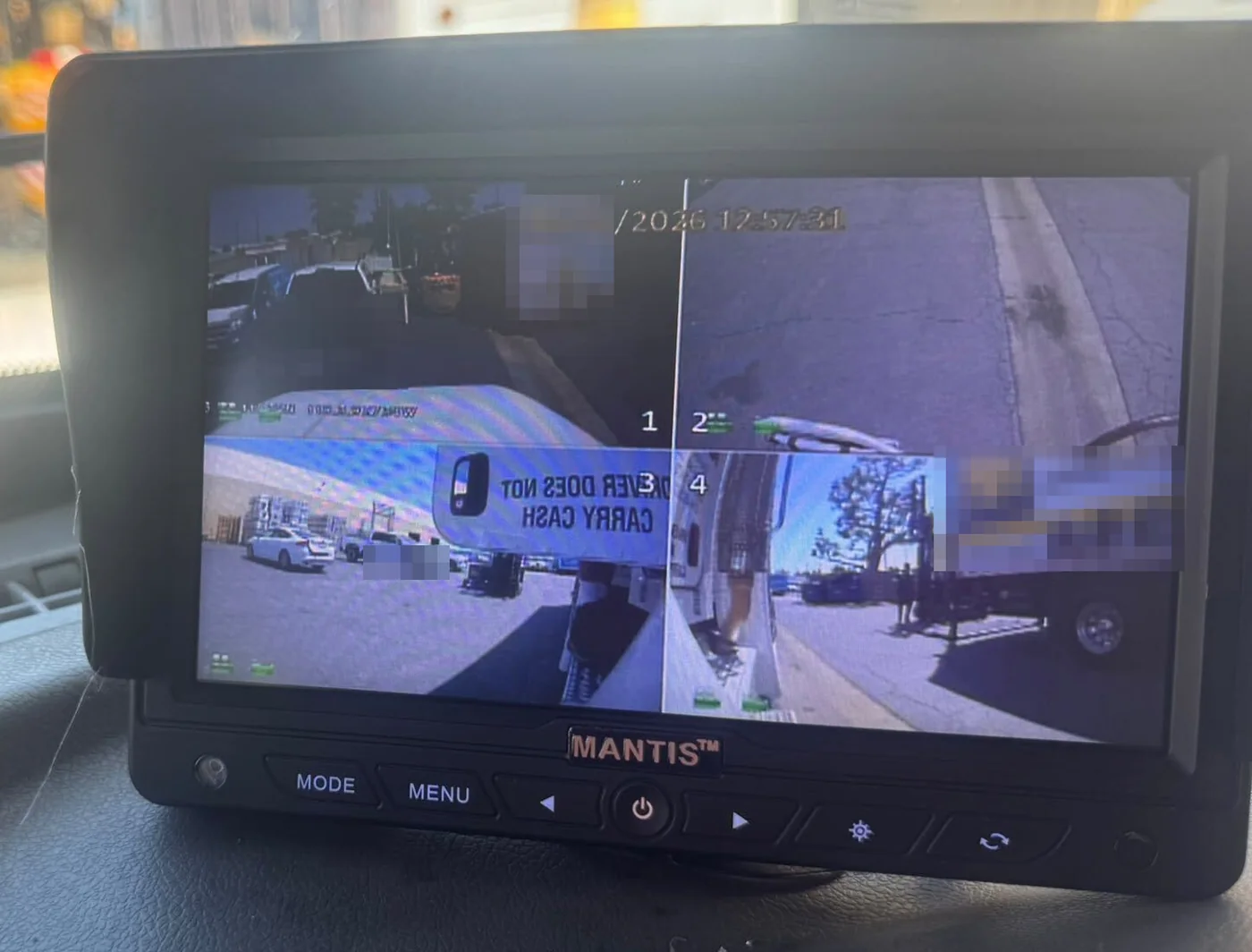 A MANTIS screen on a truck dashboard showing four camera views around the vehicle at once